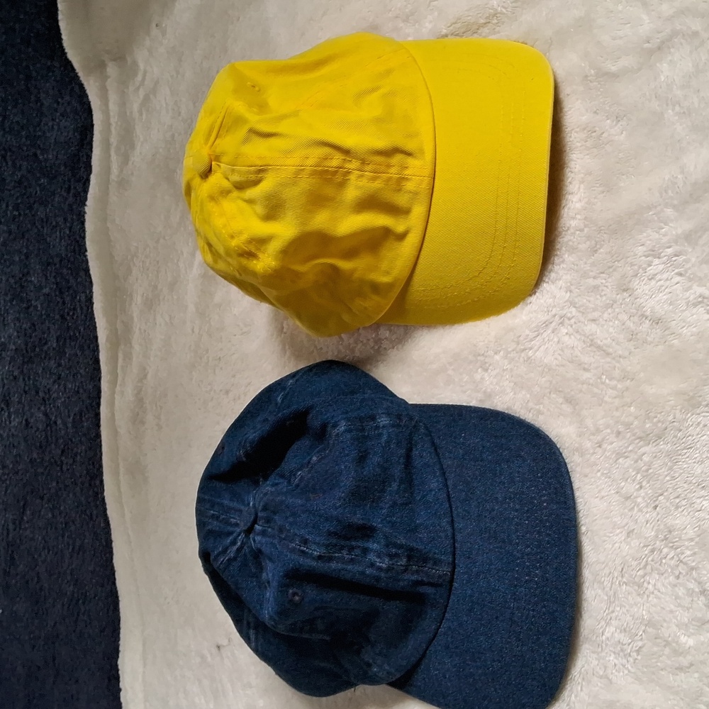 2 woman's ball caps with adjustable sizing. Yellow and blue Jean